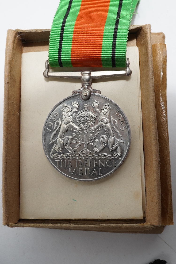 A First World War Mons Star trio awarded to Capt. A.D. Lowdell, with a clasp for 5th Aug-22nd Nov 1914, and oakleaf - mention in dispatches, together with the miniature set, plus a WWII Defence medal in its original card